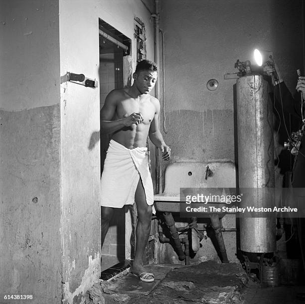 Floyd Patterson walks out of the shower at the Gramercy Gym on 14th Street, New York, New York, on January 01, 1954.