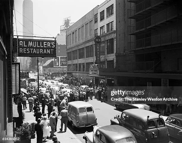 Rocky Marciano arrives with a street full of fans for the weighing-in before his bout against Archie Moore in New York, New York on September 21,...