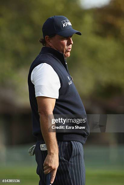 Phil Mickelson reacts to his putt on the 14th hole during round one of the Safeway Open at the North Course of the Silverado Resort and Spa on...