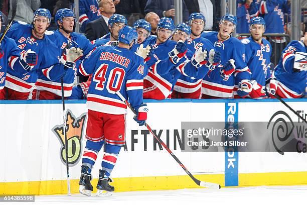 Michael Grabner of the New York Rangers celebrates after scoring in the first period against the New York Islanders at Madison Square Garden on...