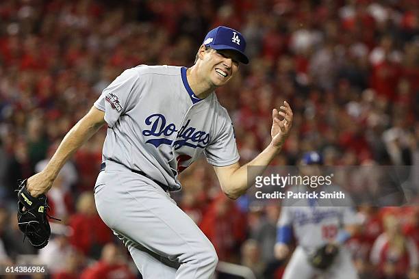 Rich Hill of the Los Angeles Dodgers reacts after being injured in the first inning against the Washington Nationals during game five of the National...