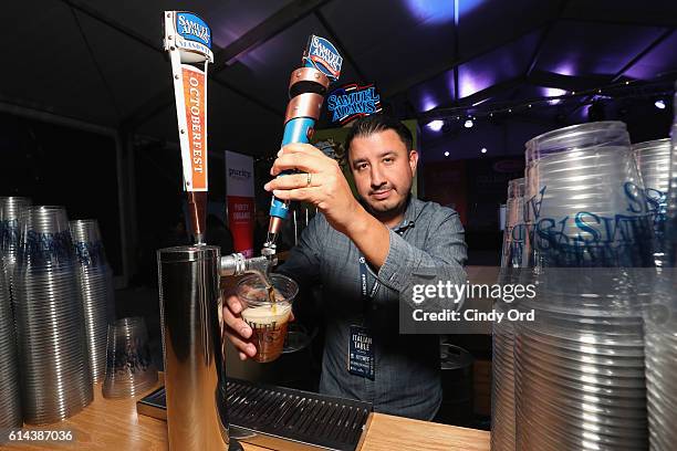 Bartender pours a glass of Samuel Adams beer at Barilla's Italian Table hosted by Giada De Laurentiis during the Food Network & Cooking Channel New...