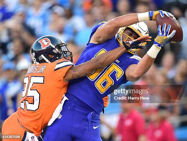 Hunter Henry of the San Diego Chargers makes a catch for a touchdown in front of Chris Harris of the Denver Broncos to take a 7-0 lead during the...