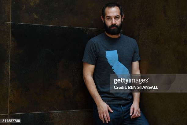 British director Daniel Gordon poses for a photograph following an interview in central London on October 13, 2016. - Football legend George Best's...