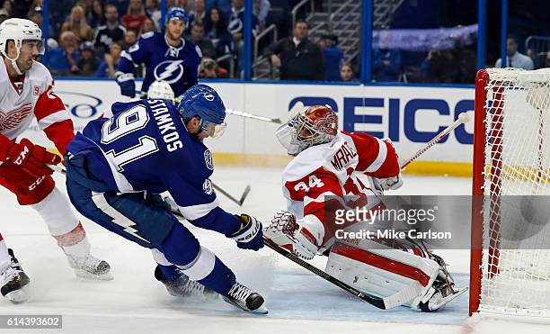 Petr Mrazek of the Detroit Red Wings makes a save against Steven Stamkos of the Tampa Bay Lightning during the second period at the Amalie Arena on...