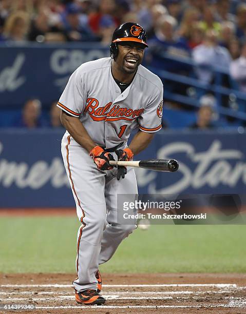 Michael Bourn of the Baltimore Orioles reacts after fouling a ball off his leg in the fourth inning during MLB game action against the Toronto Blue...