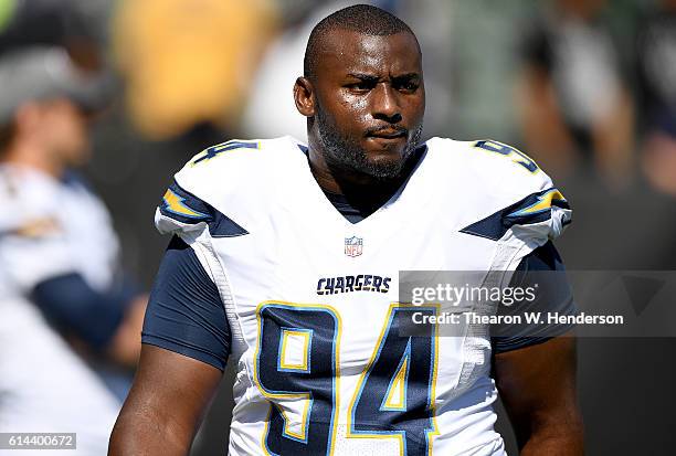 Corey Liuget of the San Diego Chargers looks on during pregame warm ups prior to playing the Oakland Raiders in an NFL football game at...