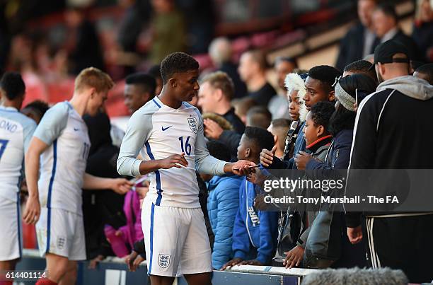 Demerai Gray of England signs autographs for the fans after the UEFA European U21 Championship qualifier match between England and Bosnia and...