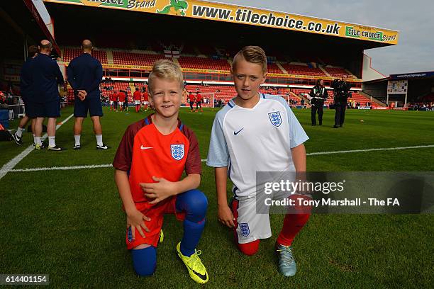 The matchday mascots pose for a photo on the pitch during the UEFA European U21 Championship qualifier match between England and Bosnia and...