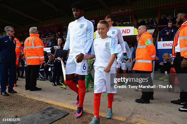 Nathaniel Chalobah of Englandleads out the team with the mascot during the UEFA European U21 Championship qualifier match between England and Bosnia...