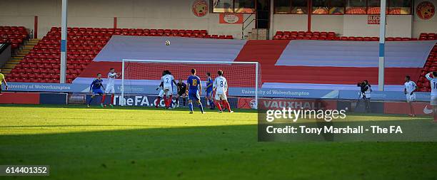 Action in front of a large England flag during the UEFA European U21 Championship qualifier match between England and Bosnia and Herzegovina at...