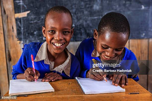 african children during english language class, kenya - kenyan culture stock pictures, royalty-free photos & images