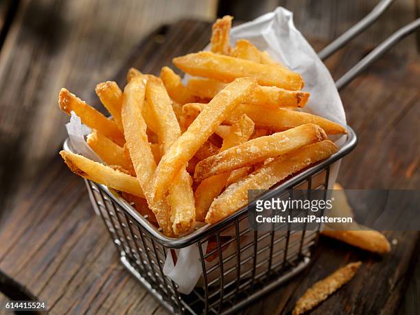 basket of french fries - french fries stock pictures, royalty-free photos & images