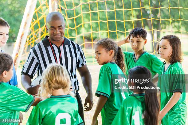 soccer referee explains rules to team - girl referee stock pictures, royalty-free photos & images