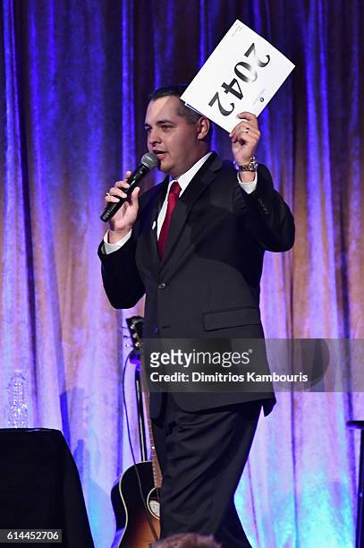 Auctioneer Jonathan Kraft speaks onstage during Global Lyme Alliance's second annual "United For A Lyme-Free World" gala on October 13, 2016 in New...