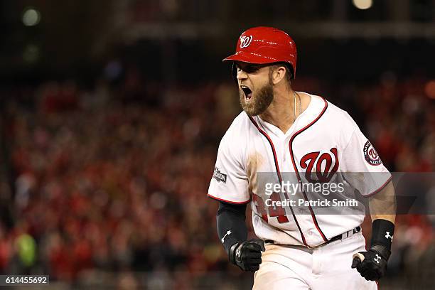 Bryce Harper of the Washington Nationals reacts after hitting a single in the seventh inning against the Los Angeles Dodgers during game five of the...