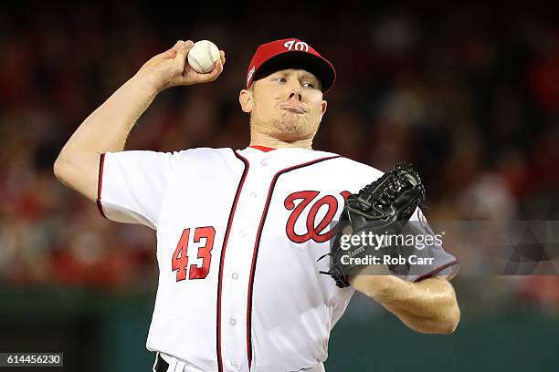 Mark Melancon of the Washington Nationals works against the Los Angeles Dodgers in the eighth inning during game five of the National League Division...