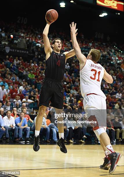 Stanford Stefan Nastic shoots over Utah Dallin Bachynski during the Pac-12 Men's Basketball Tournament game between the Stanford Cardinal and the...