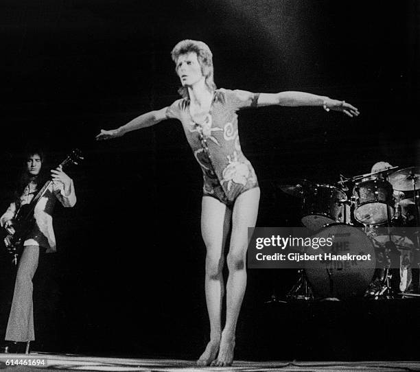 David Bowie performs on stage with Trevor Bolder and Mick Woody Woodmansey on the Ziggy Stardust tour, Earls Court Arena, London, 12th May 1973.
