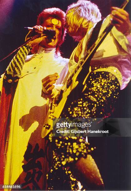 David Bowie and guitarist Mick Ronson perform on stage on the Ziggy Stardust tour, Earls Court Arena, London, 12th May 1973.