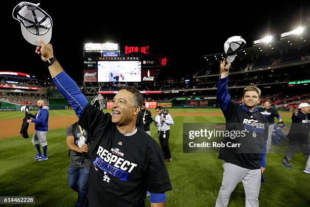 Manager Dave Roberts of the Los Angeles Dodgers celebrates after winning game five of the National League Division Series over the Washington...