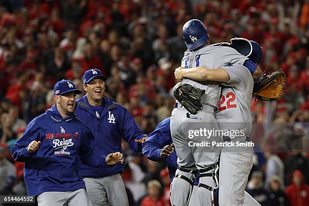 Clayton Kershaw of the Los Angeles Dodgers celebrates with teammate Carlos Ruiz after winning game five of the National League Division Series over...