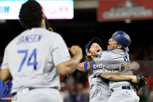 Clayton Kershaw of the Los Angeles Dodgers celebrates with teammate Carlos Ruiz after winning game five of the National League Division Series over...