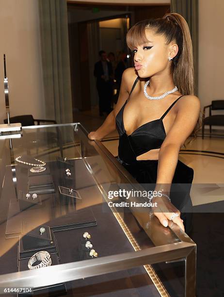 In this handout photo provided by Jones Crow, Ariana Grande attends Tiffany & Co.'s unveiling of the newly renovated Beverly Hills store and debut of...