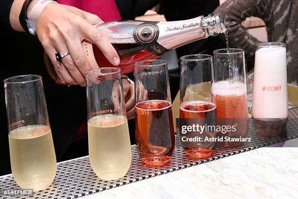 View of the NYWFF branded champagne flutes at Chicken Coupe hosted by Whoopi Goldberg and Andrew Carmellini at The William Vale on October 13, 2016...