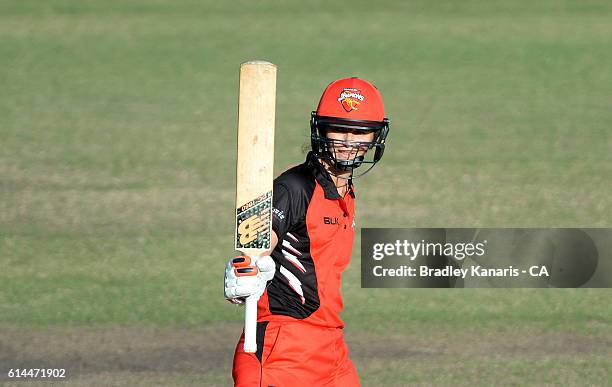 Charlotte Edwards of South Australia celebrates scoring a century during the WNCL match between Queensland and South Australia at Allan Border Field...