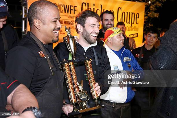 Winning Chefs Miguel Trinidad and Mark Rosati pose with their trophy at Chicken Coupe hosted by Whoopi Goldberg and Andrew Carmellini at The William...