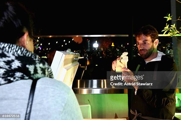 Chef Mark Rosati serves a guest ice cream at Chicken Coupe hosted by Whoopi Goldberg and Andrew Carmellini at The William Vale on October 13, 2016 in...