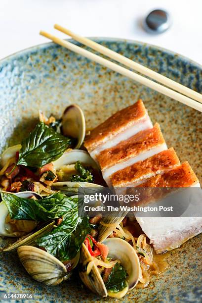 Fire roasted pork belly, littleneck clams, smokey chinese bacon and mustard greens at The Source.