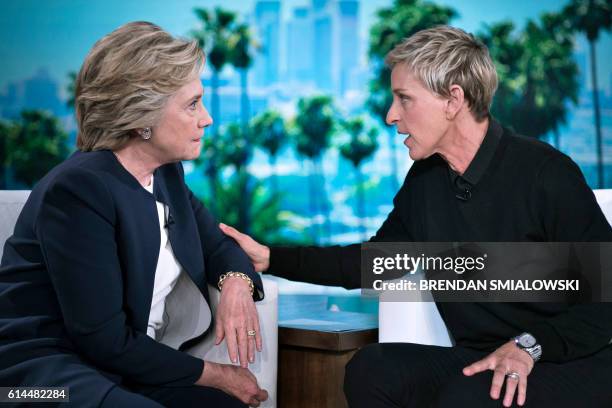 Democratic presidential nominee Hillary Clinton and tv host Ellen DeGeneres talk during a commercial break of the taping of the Ellen Show on October...