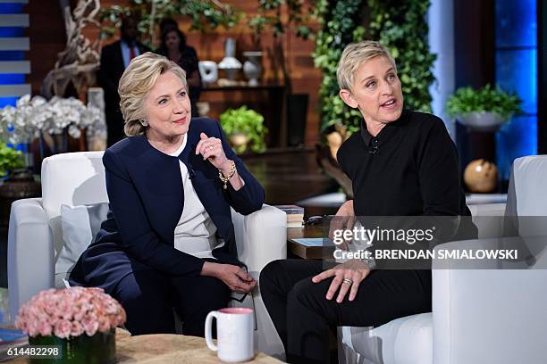 Democratic presidential nominee Hillary Clinton and tv host Ellen DeGeneres talk during a commercial break of the taping of the Ellen Show on October...