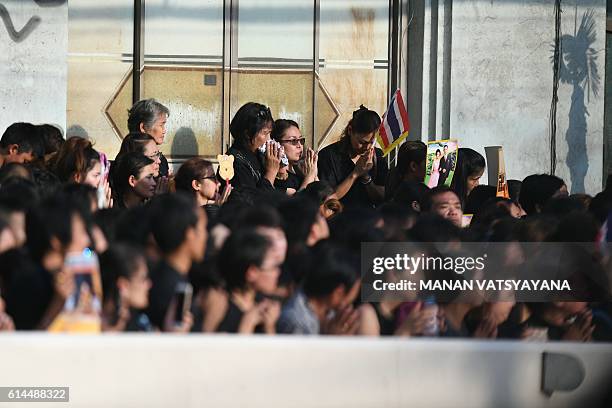 Massive crowds line the streets during the procession of Thai King Bhumibol Adulyadej's body to his palace in Bangkok on October 14, 2016. Bhumibol,...