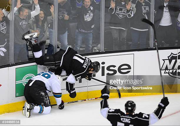 Kings Anze Kopitar "A" is tripped up by Sharks Brent Burns while celebrating a goal during game 6 of the first round of the Stanley Cup Playoffs...