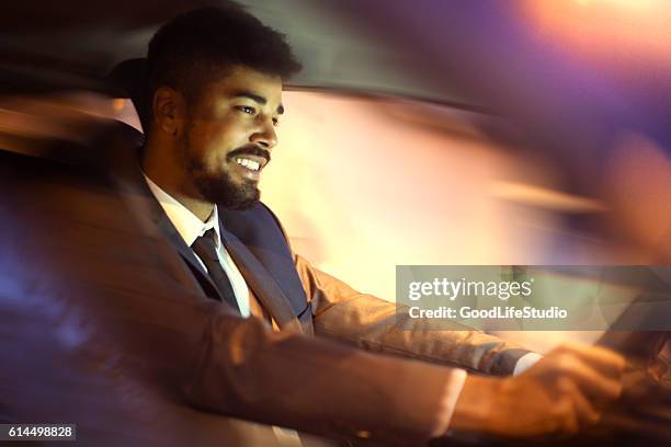 chauffeur driving car - audi car stock pictures, royalty-free photos & images