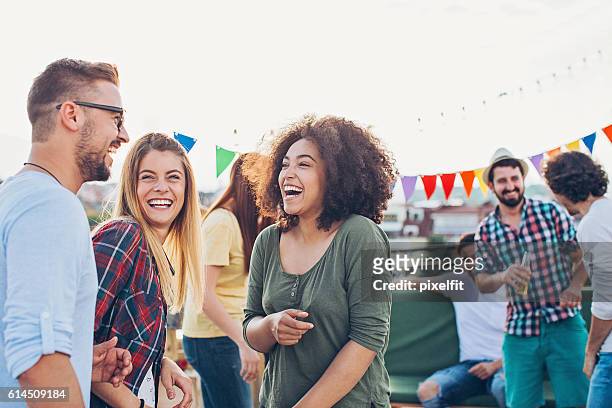rooftop celebration - party stock pictures, royalty-free photos & images