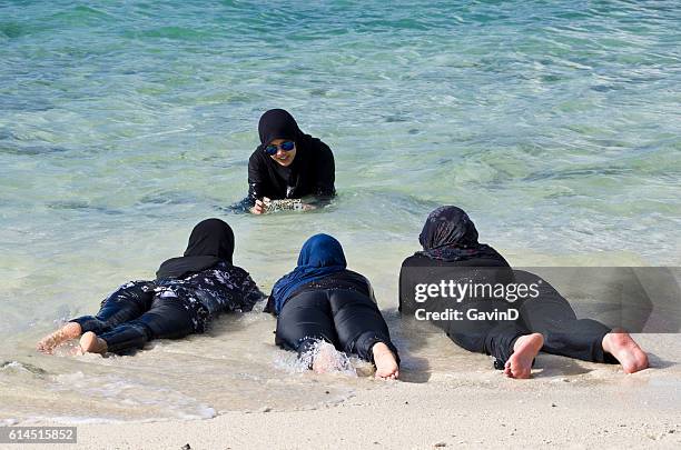 burkini muslim women pose for photograph in thailand - burkini bildbanksfoton och bilder