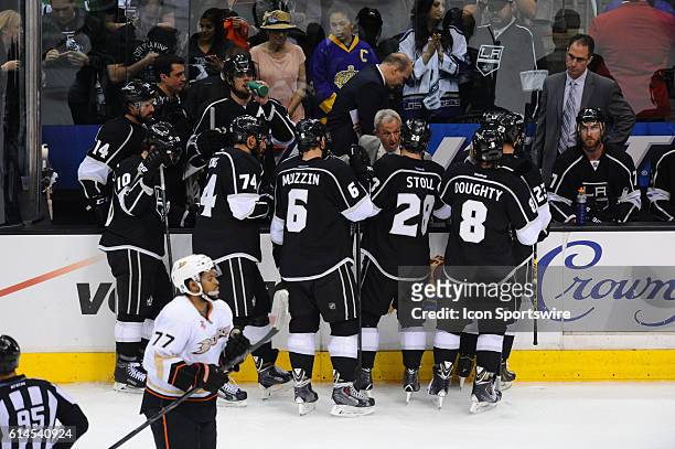 Kings head coach Darryl Sutter talks with the team during a time out during game 6 of the second round of the Stanley Cup Playoffs between the...