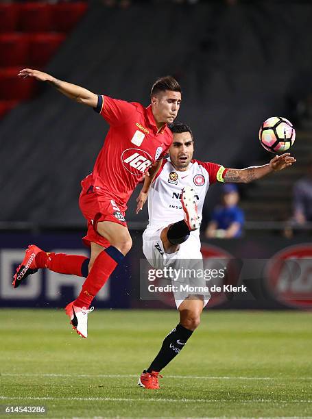 Dimas of the Wanderers competes with Sergio Guardiola of Adelaide United during the round two A-League match between Adelaide United and the Western...