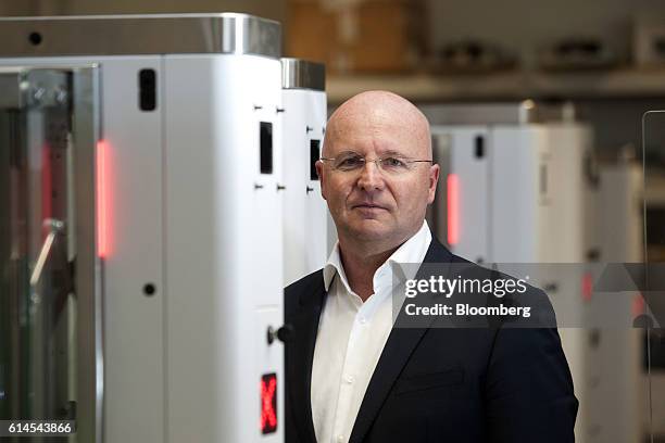 Miguel Leitmann, chief executive officer of Vision-Box Solucoes De Visao Por Computador SA, poses for a photograph beside automated border control...