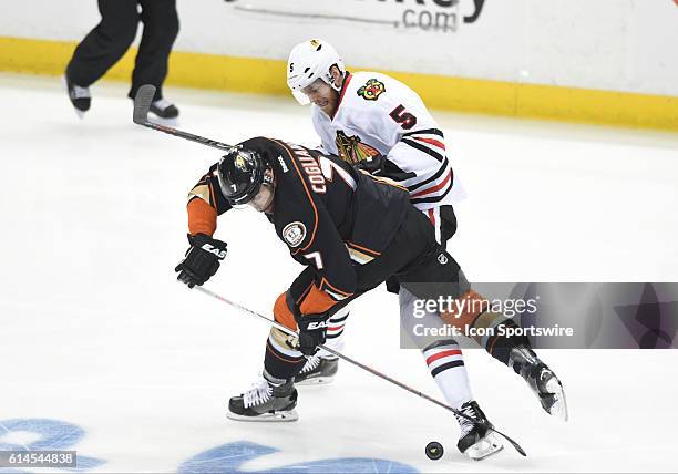 Anaheim Ducks Winger Andrew Cogliano [4994] tries to steal the puck from Chicago Blackhawks Defenseman David Rundblad [7651] during game 7 of the NHL...