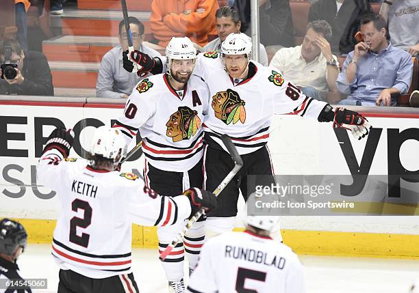 The Blackhawks celebrate after scoring their fourth goal of the game in the second period during game 7 of the NHL Western Conference Final between...