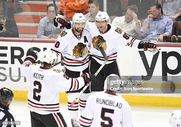 The Blackhawks celebrate after scoring their fourth goal of the game in the second period during game 7 of the NHL Western Conference Final between...