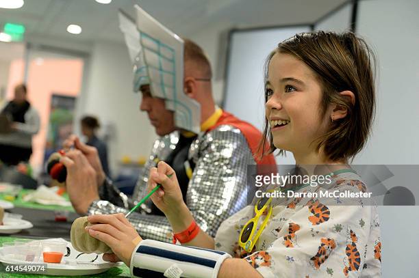 New England Revolutions Cody Cropper paints pumpkins with Sarah at Boston Children's Hospital on October 12, 2016 in Boston, Massachusetts.