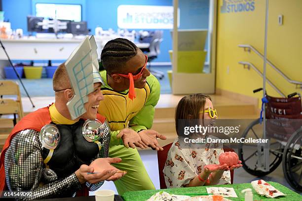 New England Revolutions Cody Cropper and Juan Agudelo visit with Sarah at Boston Children's Hospital on October 12, 2016 in Boston, Massachusetts.