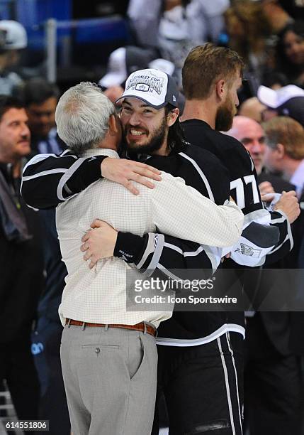 Los Angeles Kings Defenseman Drew Doughty [6495] hugs coach Darryl Sutter during the post game celebration of the Stanley Cup Final between the New...