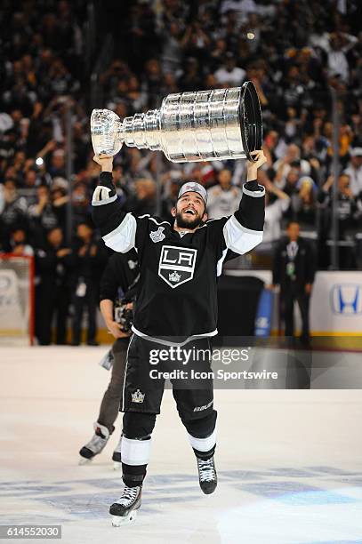 Los Angeles Kings Defenseman Alec Martinez [5300] skates with the Stanley Cup during the post game celebration of the Stanley Cup Final between the...